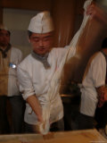 Chef Pulls Dough as He Makes Fresh Noodles in a Restaurant