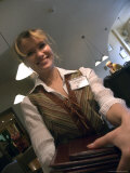 A Smiling Waitress Distributes Menus