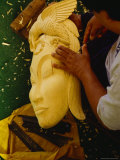 A Famous Balinese Wood-Carver Hand Carves a Mask