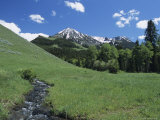 Scenic Gallatin Mountains with a Stream Running Through a Meadow