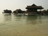 Malaysian-Style Luxury Resort Villas on Stilts Hover Above the Ocean