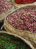 Baskets of Chilies and Shallots in Baskets at an Open Air Market