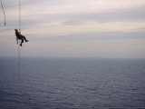 Remote Access Technicians Dangle off Ropes on an Oil Rig