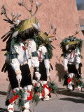 Native American Men Perform a Deer Dance in Costume