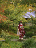 Kimono-Clad Geisha in a Park Near a Stream