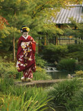 Kimono-Clad Geisha in a Park Near a Stream