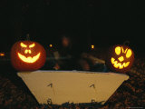 Illuminated Jack-O-Lanterns on the Back of a Rowboat