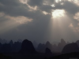 Sunlight Illuminates Limestone Peaks in a Karst Region near Guilin  Guangxi Province  China