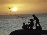 Silhouetted People Fish from the Shoreline near Montevideo  Montevideo  Uruguay