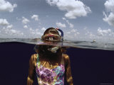 Aquatic Split-Level View of a Woman Wearing Snorkeling Gear