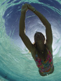 A Young Woman Swimming in Clear Water off of Grand Cayman Island