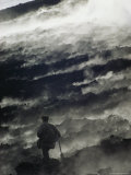 A Man Walking Across Steaming Ground Near an Active Volcano