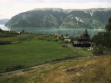 Scenic Mountain and Fjord View with Urnes Stave Church in Foreground