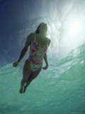 A Young Woman Swimming in Clear Water off of Grand Cayman Island