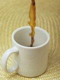 A Cup of Energy Filled Coffee is Poured into a Mug