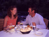 A Young Couple Eats Dinner by a Riverside  Steamboat Springs  Colorado