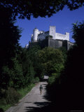 A Man Walks Toward the Salzburg Castle  Salzburg  Austria