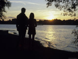 A Couple Admire the Sunset Over the Lake Chiemsee in Bavaria  Fraueninsel  Germany