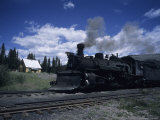 A Steam Engine Passes Through a Station in the Mountains  Cumbres Pass  Colorado