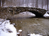 An Old Stone Bridge Over Rock Creek During a Snow Storm