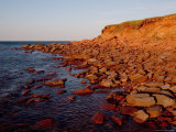 The Almost Unnatural Red of Rocks of Island Light up at Sunset  Prince Edward Island  Canada