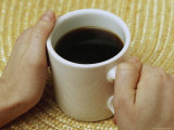 Mug of Coffee Between Two Hands