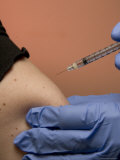 A Woman Gets a Shot in the Arm