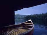 A Canoe Sticks Out of a Boathouse on an Early Morning Day  Quebec  Canada