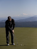 A Man Golfs on a Beautiful Course