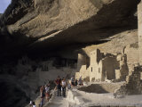 Tourists Admire the Ancient Anasazi Ruins of Mesa Verde  Colorado