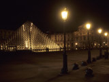 The Pyramid Designed by Im Pei Lights up the Louvre Museum at Night  Paris  France