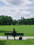 A Man Sits in the English Garden in Munich