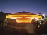 Fun on a Spinning Carousel at Night