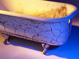 Chipped and Cracked Antique Clawfoot Bathtub