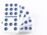 Pile of Black and White Dominoes Against White Background