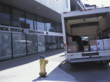 Delivery Truck Parked in Front of Building and Fire Hydrant