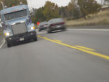 Semi and Cars Speeding on Two-Lane Highway