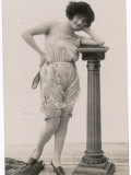 Lady in Her Undies and Gartered Stockings Leans Cheekily on a Pillar