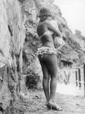 Girl in Bikini Walks Along a Cliff Path on a Fine Summer Day