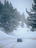 Car on Snowy Road  California
