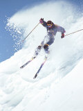 Alpine Skiing  Downhill Skier Blasting a Cornice
