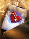 Key on Red Heart in Golden Box with Ribbon