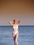 Portrait of Woman in Swimsuit Walking in Water