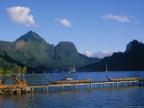 Traditional Outrigger Canoes with Sailboats