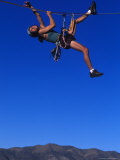 Female Rock Climbers Hang off Rope