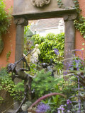 Statue Reflecting in a Mirror Used to Make the Garden Appear Bigger