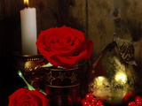 Lit White Candle in Gold Holder with Two Red Roses  Ilex Berries & Gold Pear Christmas Ornament