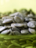 Pumpkin Seeds  Close-up of Seeds in a Green Glass Bowl