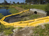 Floating Yellow Barriers in Borrow Pit Pond Control Runoff of Construction Site  Sarasota  Florida