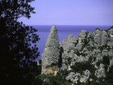 Climber Atop a Limestone Rock Face  Sardenia Italy